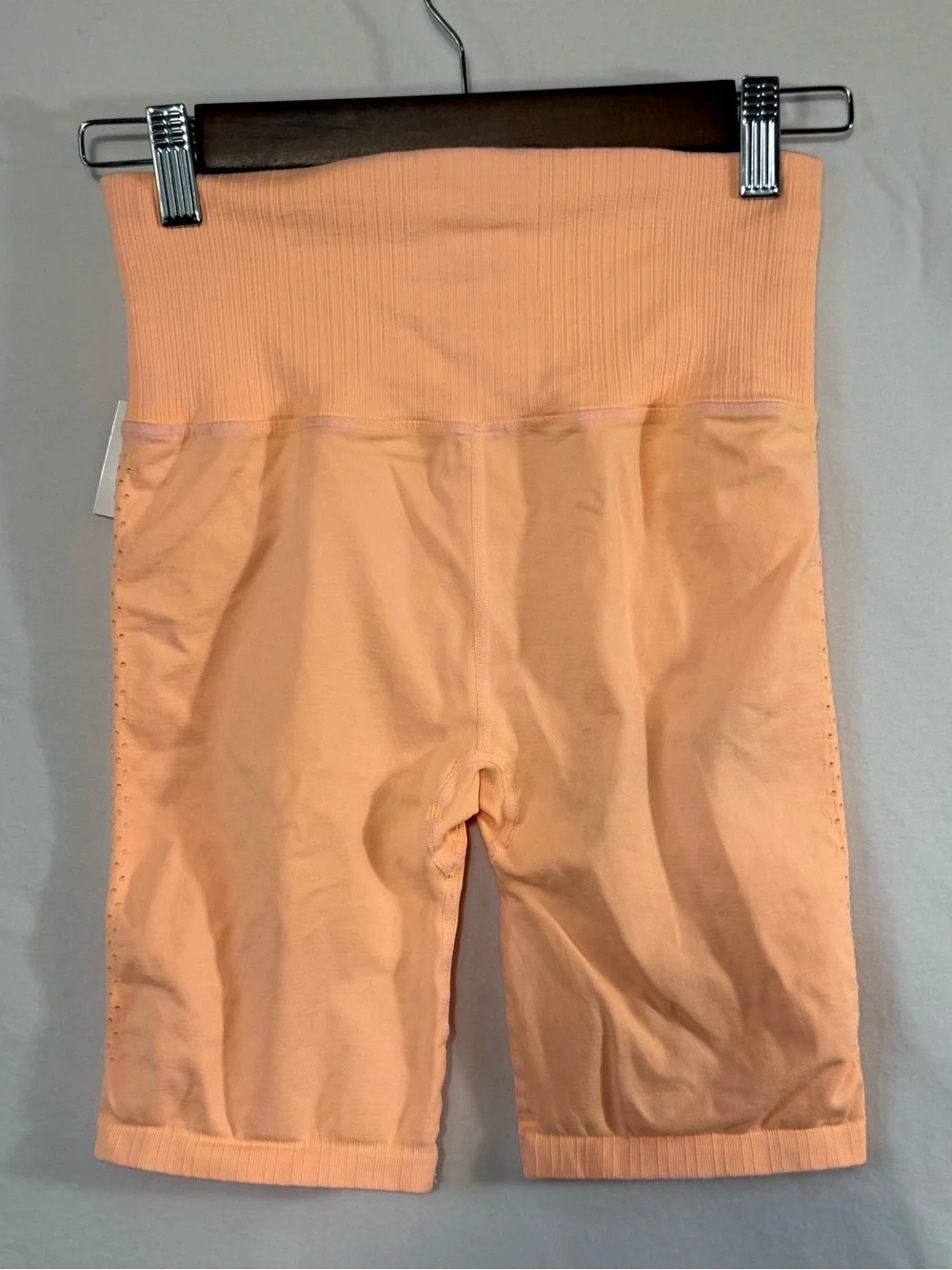 Free People Movement Good Karma Bike Shorts in a vibrant, peach-orange shade
